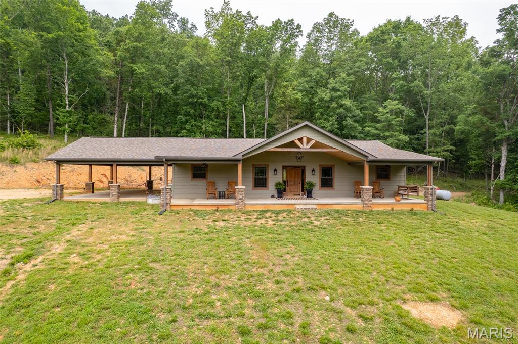 Amazing farm featuring a stunning custom home on 259.3 +/- acres in beautiful Southern Iron and Northern Wayne County! The home has LP Smart Siding. This gorgeous ranch-style home is perfectly elevated to capture breathtaking views across the rolling fields and countryside. Inside, you’ll find an open-concept living, dining, and kitchen area designed for comfort and entertaining. 
The chef’s kitchen is absolutely spectacular, featuring a massive quartz island, custom cabinetry, stainless steel appliances, gas cooktop, double wall ovens, microwave, refrigerator, and water softener. The spacious living room offers a beautiful stone gas fireplace, creating a warm and inviting atmosphere. The luxurious primary suite includes a relaxing soaking tub, separate walk-in shower, and quality Anderson windows throughout the home, and LP Smart Siding. Outdoor enthusiasts will fall in love with this property! Excellent hunting opportunities abound with abundant wildlife, mature woods, open pastureland, and diverse terrain. The farm also includes 2 spring-fed ponds, a small creek running through the property, and plenty of pasture for cattle, horses, or other livestock. A separate cabin on the property is perfect for hunting guests, family, or weekend retreats. 

Conveniently located near the beautiful 7 Lakes area and just minutes from Clearwater Lake, Clearwater Marina, Bluff View Marina, Sam A. Baker State Park, Elephant Rocks State Park, and Johnson’s Shut-Ins State Park. Approximately 1.5 hours from South County St. Louis, 1 hour from Poplar Bluff, and 1 hour from Farmington. This hidden gem truly must be seen to be appreciated!  This is a duplicate listing see MLS #26032019. 

Wayne County Parcels  04-4.1-20-000-000-0003.000, 04-4.1-20-000-000-0004.000. Iron County Parcels 19-4.0-17-00-00-000-010-0000,
19-4.0-17-00-30-002-003-0000.