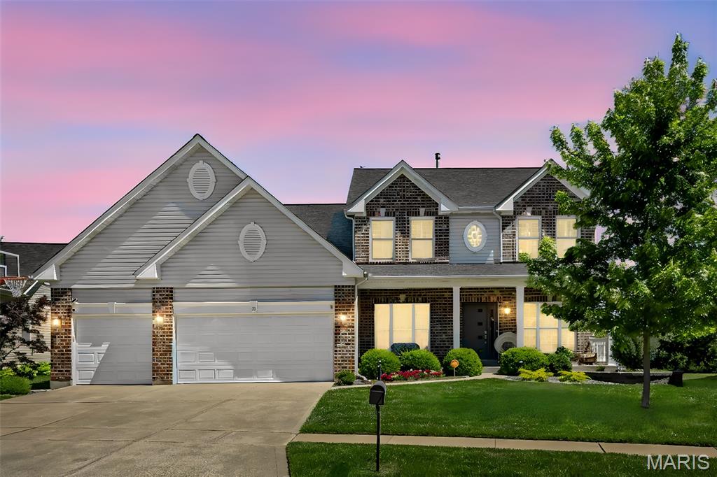 Welcome Home to 46 Heritage Pointe Circle.  Some homes are simply move-in ready. This one is ready for life.  

Tucked into a quiet cul-de-sac in the heart of Fenton's sought-after Legacy Pointe subdivision, this move-in ready, beautifully updated 4-bedroom, 4-bath home is zoned for the highly regarded Uthoff Valley Elementary and Rockwood Summit High School — two of the top-rated schools in the Rockwood School District. A neighborhood bus stop right on the corner means an easy, safe commute to school, with no busy street crossings required. Step inside to rich hardwood floors and a thoughtfully designed open-concept layout that flows naturally from room to room. The living room's custom built-ins and bold designer accents create a space that feels curated, not cookie-cutter. The adjoining dining room, wrapped in striking wallpaper beneath a dramatic tray ceiling, sets the stage for everything from casual family dinners to milestone celebrations. 
The updated kitchen anchors the home with a generous island and abundant cabinetry, designed for real life — morning coffee rushes, weekend baking projects, and everyone gathering before dinner. Serious cooks will appreciate the premium GE Monogram 36-inch gas cooktop with integrated downdraft vent and GE Monogram double wall oven, paired with a brand-new dishwasher for effortless cleanup. Upstairs, the primary suite is a true retreat — a vaulted ceiling, dedicated sitting area, and ensuite bath create a private escape at the end of the day. The custom walk-in closet is a showpiece in its own right, with dedicated his and hers sides — hers featuring a locking jewelry drawer  — plus generous shoe storage on both sides. Three additional bedrooms each feature their own custom-designed walk-in closet systems, offering the kind of thoughtful storage that's rare to find. 
The finished lower level offers two distinct spaces designed for the way your family actually lives. A dedicated media room with surround sound is perfect for movie nights or watching the big game, while an entertainer's lounge — anchored by a custom wet bar with integrated wine cooler — sets the scene for game nights, holiday gatherings, or simply unwinding after a long day.

Outside, privacy is the headline. Unlike many homes in the area, 46 Heritage Pointe backs to no rear neighbors, creating a true sense of seclusion rarely found this close to the heart of Fenton. New 8-foot Andersen sliding doors open onto a spacious covered deck, perfect for dining and lounging rain or shine. Just steps away, an outdoor kitchen with a kamado-style grill makes weekend cookouts effortless, while a hot tub and beautifully landscaped patio with a soothing water feature round out the entertaining space. Beyond the patio, an expansive, fully fenced backyard offers plenty of room for kids to run, play, or for a future swing set or trampoline. Major systems have been thoughtfully maintained, including a new roof, new upstairs HVAC system, a new washer and dryer, and a whole-home surge protector. The 3-car garage includes a dedicated EV charger, ready for your electric vehicle from day one. 

An exceptional value in Legacy Pointe. With premium finishes, true outdoor privacy, and a level of craftsmanship rarely found in the neighborhood, 46 Heritage Pointe offers a compelling opportunity in one of Fenton's most desirable communities.  This move-in ready home is more than a house — it's where your family's next chapter begins.