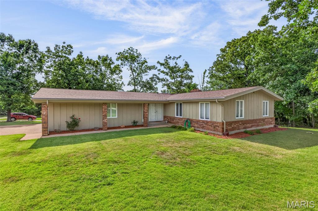 You dont want to miss this 3 bed 2 bath home on a corner lot in Terre Du Lac.  Features a large living room with cathedral ceiling and a wood burning fireplace.  3 large bedrooms with plenty of natural light. A large L shaped kitchen and eating area and  a pass thru laundry area . You can enjoy your moring coffee in the 3 season room with lots of windows. There is an oversize 2 car garage with plenty of storage.  You will have access to the 4 ski lakes, a 9 hp limit lake and lots of smaller lakes.  You can fish , swim, boat in the lakes. Play golf at the 18 hole course, enjoy parks, dog park, Big River access and so much more here in this private community Just and hour from St Louis, this can be your weekend getaway or a permenant address.