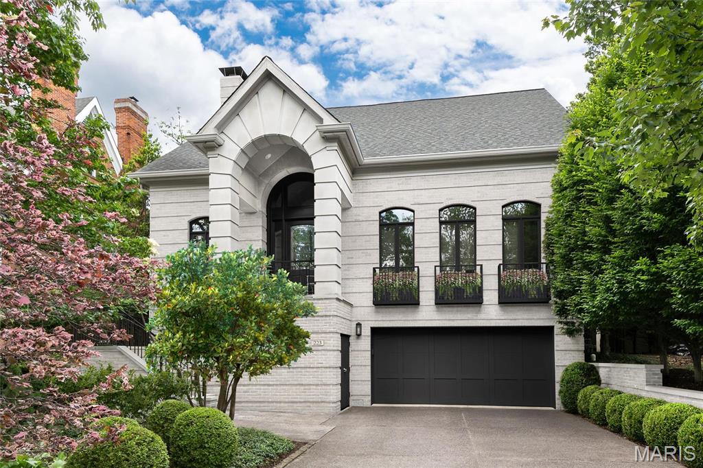 Spectacular setting and ideal location. This Executive property was one of the first homes built in the area to transform Old Town Clayton to the exclusive neighborhood it is today. The floorplan is perfect with a Main Level Primary Suite and elevator.  Extensive landscaping accents this stately property. Kitchen and primary suite bath are only 6 years old. Classic Dining Room seats 10. Living Room features vault ceiling, gas fireplace and open stairway to 2nd level. Primary Suite walks out to private grounds , and the luxe bath features jet tub, separate shower and dual organized closets. Abundant natural light fills the home. Enclosed all-season room is the perfect retreat. Den is detailed with built in cabinetry and gas fireplace. Finished Lower Level includes recreation and exercise rooms, full bath and 4th BR currently used as a home studio. 3-car garage with tandem parking. Ready for your cosmetic touches to recreate a modern and elegant vision. Additional Rooms: Sun Room
