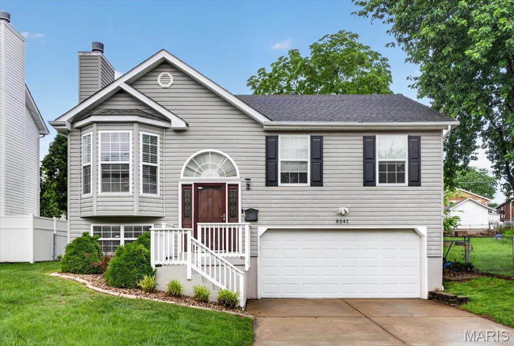 Welcome home to this Affton split-level gem with 3 bedrooms and 2 1/2 bathrooms offering the perfect blend of style, comfort, and functionality! The open-concept main level living space features cathedral ceilings, hardwood floors, and abundant natural light. Gather in the spacious living room highlighted by a charming bay window and cozy wood-burning fireplace. The kitchen boasts granite countertops, 42" cabinetry, stainless steel appliances, a pantry, attractive tile backsplash, and an adjoining dining area with easy access to the deck and patio.
The private primary suite offers generous closet space and an ensuite bath with a double vanity. Two additional bedrooms and a full hall bath complete the main level. Brand-new carpeting throughout all bedrooms and lower level and newer lighting add fresh appeal throughout.
The finished lower level provides a versatile family room, office, or recreation space with large windows for plenty of natural light, plus a convenient half bath, laundry room, and access to the attached two-car garage.
Step outside to enjoy the large fenced backyard, deck, and patio—perfect for entertaining, gardening, pets, or play. Additional driveway parking adds convenience. Located in the highly sought-after Affton School District and just minutes from shopping, dining, parks, and the popular 9 Mile Garden, this home offers an exceptional lifestyle in a fantastic location.   Hot tub excluded.