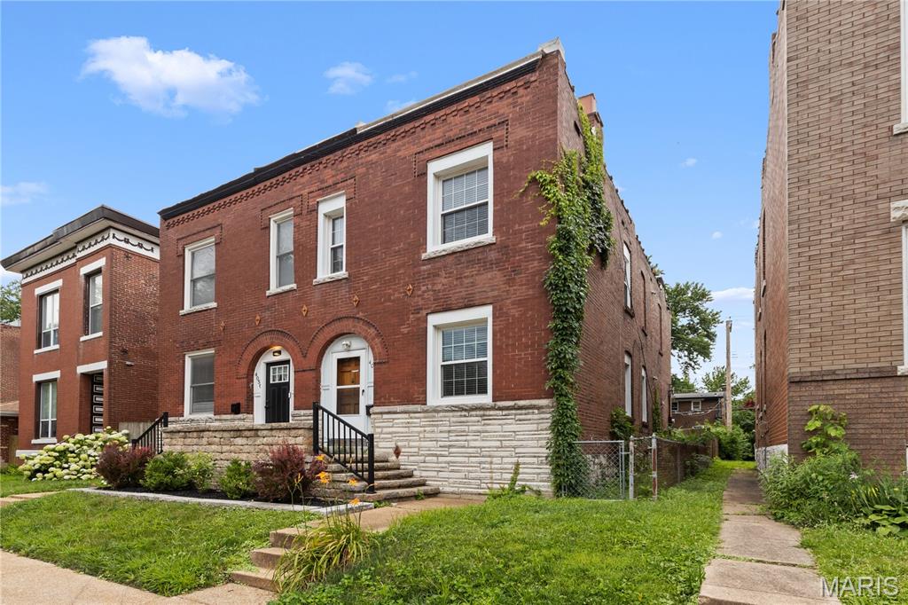 Welcome home to 4058 Botanical! This spacious 3 bedroom 2 bathroom fee simple attached townhome has no monthly HOA fees and is located in one of the most beautiful Shaw neighborhoods in the city nestled between Tower Grove Park and the Botanical Gardens. It's available just in time for all of the summer events starting in the area! The home has historic charm with the 2 gorgeous fireplaces as well as modern updates such as a main floor laundry, updated kitchen and bathrooms and beautiful slate tile.  Upstairs there's 3 spacious bedrooms and a full bathroom. Private fenced in backyard with a nice deck and 2 off street parking spaces. Come see this one today before its too late!