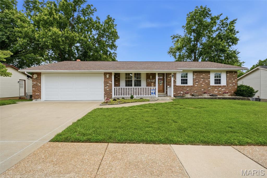 OPEN SAT 6/27 from 12-2PM! (c.) 1972: Meticulous & immaculate only begin to describe this beautiful 3+ bedroom, 3 full bathroom ranch home in the River Oaks subdivision & Mehlville Schools. Having been carefully maintained and loved by the same family for over 50 years, this one is special... it shows like a display and is clean enough that one could eat off the (beautiful hardwood) floors! Sharp curb appeal from the street pulls you onto a newer driveway & stamped concrete front walkway and up onto the covered porch. Step inside to find a formal living room with hardwood floors, and then a great open concept kitchen (updated ~2010) with TONS of counter and cabinet space, breakfast bar, stainless steel appliances & more. A corner wood burning fireplace flanks the dining area (but could be used as a family / TV space). The crown jewel & sure to be the heart of this home is the vaulted 4-season glass enclosed sunroom addition that overlooks the spacious & lush backyard. Back down the hall, find a primary bedroom suite w/private full bathroom, and 2 additional nice bedrooms each with generous closets that share a hallway full bathroom. Then, the spacious, mostly-finished, walk-out lower level features another large family/rec room, eating area, great bar area w/refrigerator, additional large extra bedroom/sleeping space, full bathroom, laundry room and 2 addt'l storage areas. A great sliding glass door leads to your spacious covered patio (complete with ceiling fans to move that warm summer air) and overlooks your spacious fenced back yard. Large shed stays, and gates on side of home accommodate bringing large equipment into the yard. An attached 2-car garage w/opener and room for 4 addt'l cars off-street on the widened concrete driveway complete the equation. As for updates... too many to list, but a few notables: new roof in 2025; water heater 2024, furnace/AC replaced in 2013; newer windows throughout (done at various times); newer electric panel upgrade; and much more! This is one you won't want to sleep on, or you're sure to miss out! Priced below recent Mar 2026 $350k appraisal value!
