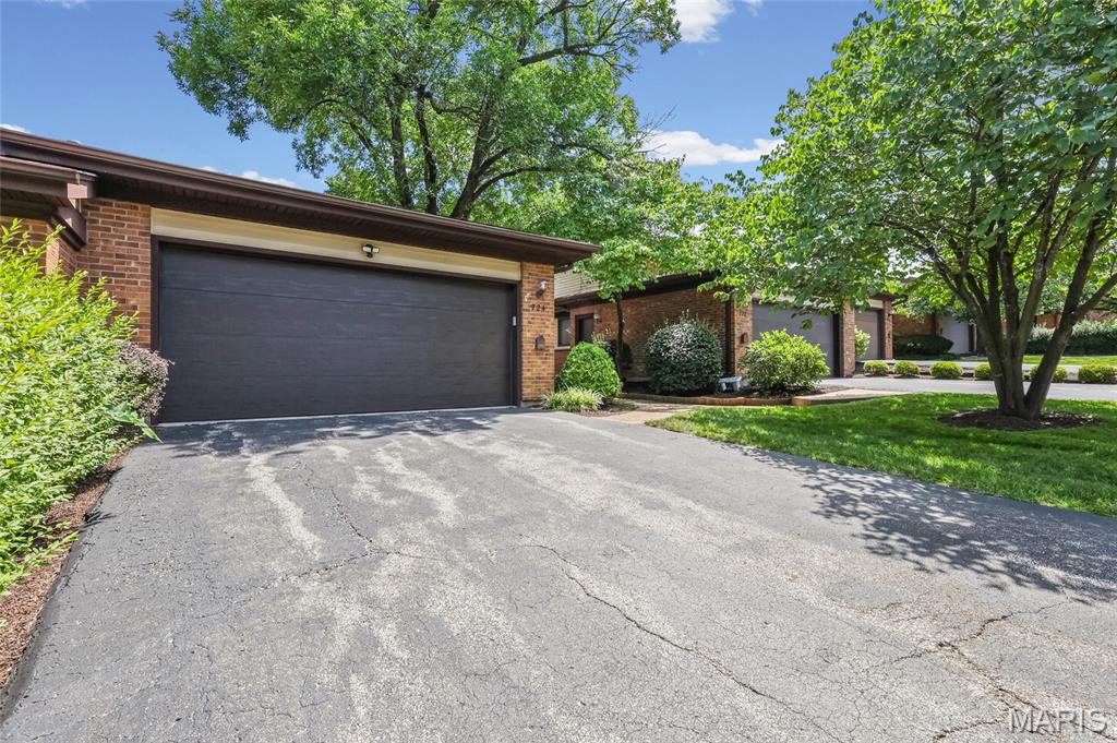This ranch-style villa, featuring an attached two-car garage, is located in the highly desirable Treetop condominium community. It’s everything you’ve been waiting for! 
As you enter through the front door, you’ll be welcomed by a foyer leading into a vaulted great room and dining room combo. Natural light streams in through two skylights, highlighting the accent fireplace and sliding patio doors that open to your deck. The main living area is adorned with luxurious wood flooring throughout.
Adjacent to the great room, the kitchen boasts a cozy breakfast room with access to the deck. It features a breakfast bar, solid-surface countertops, and custom cabinetry, making it a delightful space for cooking and entertaining. The main floor laundry is conveniently located just a few steps away.
The primary bedroom is privately positioned and includes its own full bath. If you need an office, either bedroom 2 or 3 can easily serve this purpose. The walk-out lower level offers a fourth bedroom, a full bathroom, and a recreation room with a second fireplace and patio access. Additionally, you’ll appreciate the privacy offered between units! Condo fee covers trash, water, sewer, exterior, roof, snow removal, pools, clubhouse, landscaping, and exterior insurance. This is a very ACTIVE community with various groups such as book club, bible study, gardening, along with community events!