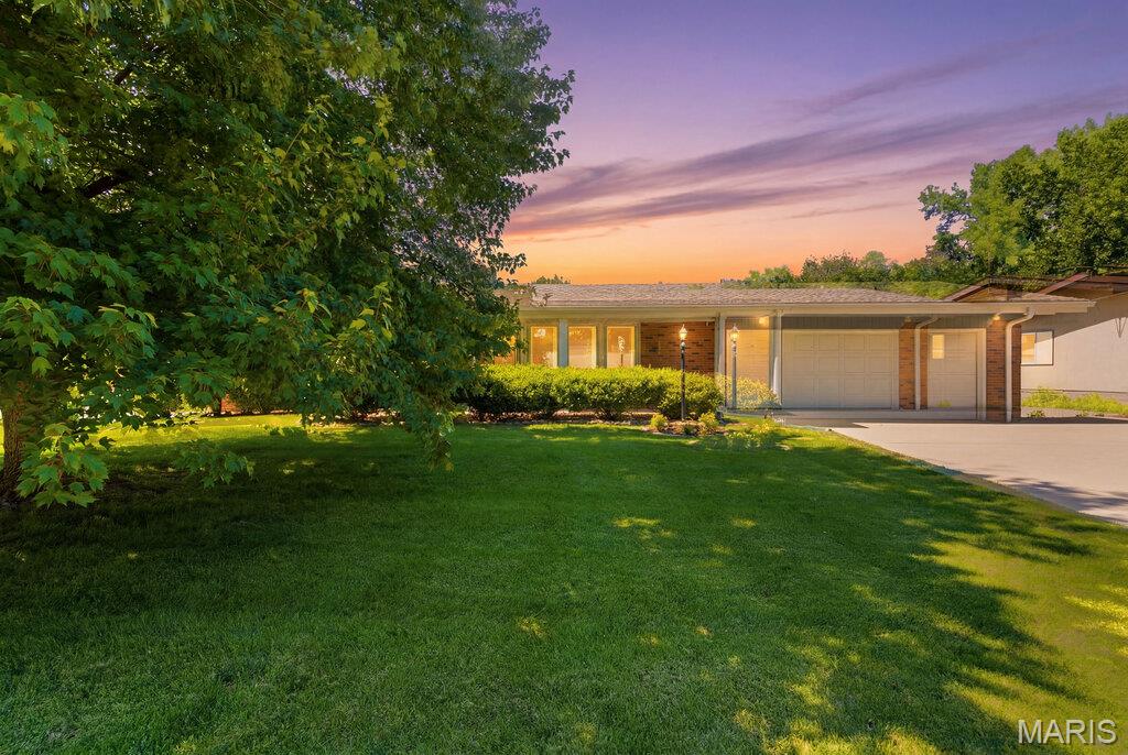 Discover a lifestyle of enduring appeal at this beautiful ranch with 3 bedrooms and 2.5 baths that offers a unique opportunity to craft your ideal living environment. This property enjoys a 2-car attached garage and an additional parking pad to the side of the garage. The great room boasts newer neutral carpet, and the kitchen and hallway have luxury vinyl flooring. You will love the kitchen with a smooth top range, stainless steel refrigerator, wall oven, breakfast bar, and pantry. There are some newer insulated windows. The finished, walk-out lower level is huge and offers a half bath, wet bar, and so much great space for living! It walks out to a patio, and the level, spacious fenced backyard is a dream! Enjoy this summer on the deck! The hall bathroom was recently renovated, and the primary bedroom features a full bath as well. A new electrical panel was installed in 2025. There is ample living and storage space to appreciate in this lovely, well-maintained Overland home! You are so close to highways, shopping, and more! This is the one you have been waiting for!