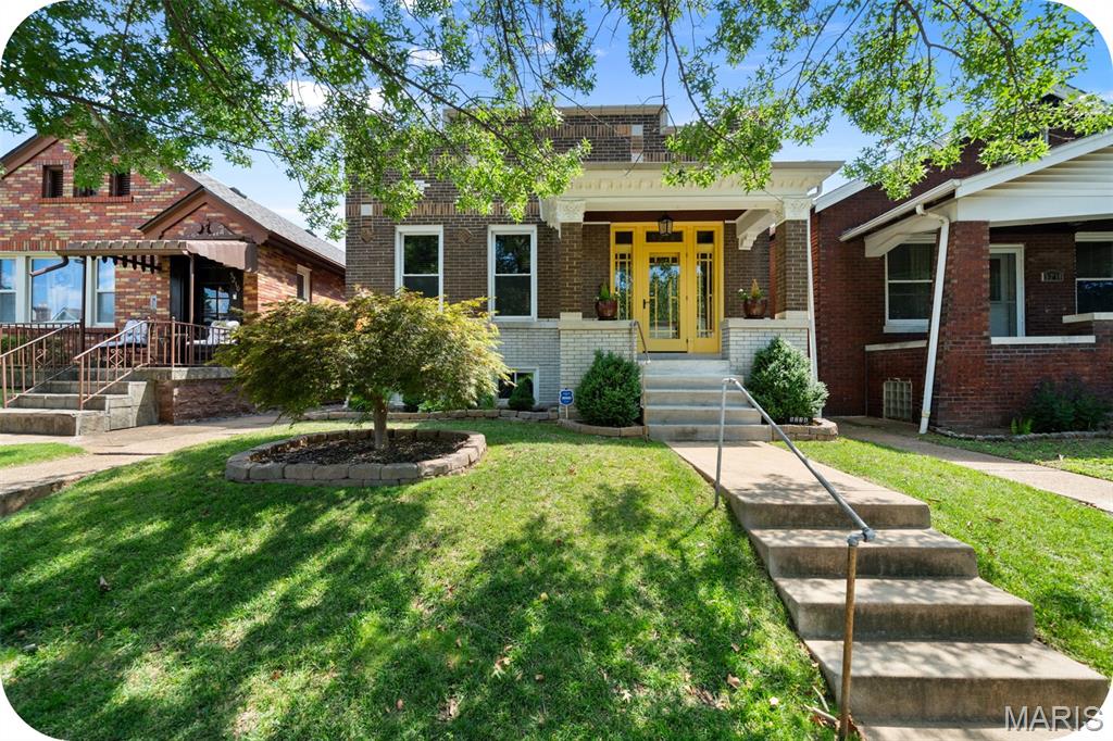If you've been searching for a home that's been truly loved and meticulously maintained, this Princeton Heights gem is one you won't want to miss. Thoughtfully updated while preserving its original character, this home seamlessly blends timeless craftsmanship with modern conveniences. From the beautifully renovated kitchen, updated bathrooms to the finished walk-out lower level, newer two-car garage, and newer HVAC - every improvement has been made with quality, care, and longevity in mind.

The classic brick exterior, limestone details, and charming tiled front porch set a welcoming tone, opening into a handsome foyer. From there, step into an inviting living room w/ custom built-ins and a dining rooms with gorgeous coffered ceilings, rich original woodwork, and stunning historic stained-glass transom windows.

The renovated kitchen boasting premium countertops, custom cabinetry, stainless steel appliances, and a large peninsula that serves as the heart of the room. From here, leading seamlessly out to the backyard deck. This outdoor oasis acts as a true extension of the indoor living space, featuring a spacious covered deck perfect for morning coffee, weekend grilling, or entertaining friends and family.

On the main level you'll find two generously sized bedrooms, including a primary suite featuring a charming bump-out room separated by French doors. Whether you're dreaming of a home office, reading nook, meditation space, this versatile space offers possibilities. Custom wood blinds throughout the home provide a warm, polished finishing touch while complementing the home's historic character.

The finished walk-out lower level adds valuable living space with porcelain tile flooring, a large family room, and a versatile flex space with great storage is perfect for a guest room, or hobby area. You'll also find a beautifully updated full bathroom complete with a deep, granite-wrapped jetted soaking tub and a separate walk-in shower. Every corner of this home reflects years of thoughtful care and pride of ownership.

Offering the perfect balance of historic charm, modern updates, and flexible living spaces, this is more than just a house—it's a place to settle in, make memories, and enjoy for years to come.