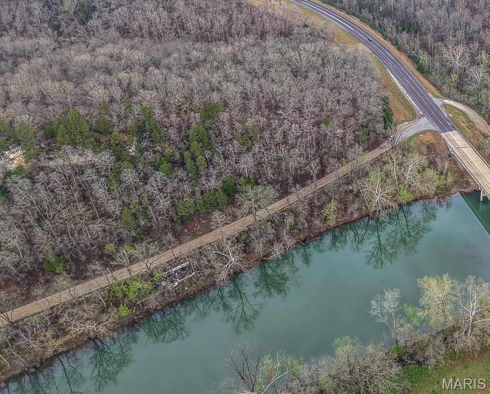 Nestled at the corner of Hwy 28 and Camp Road along the scenic Gasconade River, just above the mouth of the Big Piney, this 2.19 +/- approximate acre parcel offers a rare combination of river frontage and elevated terrain, creating endless possibilities for recreation or future development. Featuring unique topography, the property includes direct access to the river while also boasting a large bluff-like setting that provides an ideal location above the flood plain for camping, relaxing, or building your perfect weekend retreat. Conveniently located just feet from the Veterans Memorial Bridge, this property offers easy access while still capturing the peaceful atmosphere of the outdoors. Whether you’re looking for a private getaway, recreational property, camping lots, or an investment opportunity, this one-of-a-kind river parcel is packed with potential.