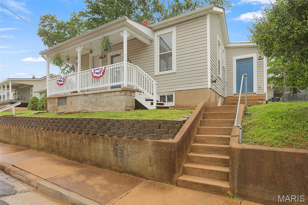 A classic little cutie in the heart of town-super close to the park, riverfront, pool and more! Brimming with character inside and out, you'll just love it! The dreamy front porch, pretty natural light inside, wood floors, and tall ceilings give it such a warm, welcoming vibe. Super cute street, great location, and ready for you to move in! Everything you need- 2 Bedrooms, 1 Bathroom, living room, main-level laundry room and the cutest kitchen.  Plenty of room in the unfinished basement for storage. Large fenced yard, storage shed, and alley parking space in the back to boot! Passed Occupancy Inspection! More pics coming soon, expected active date 5/20!