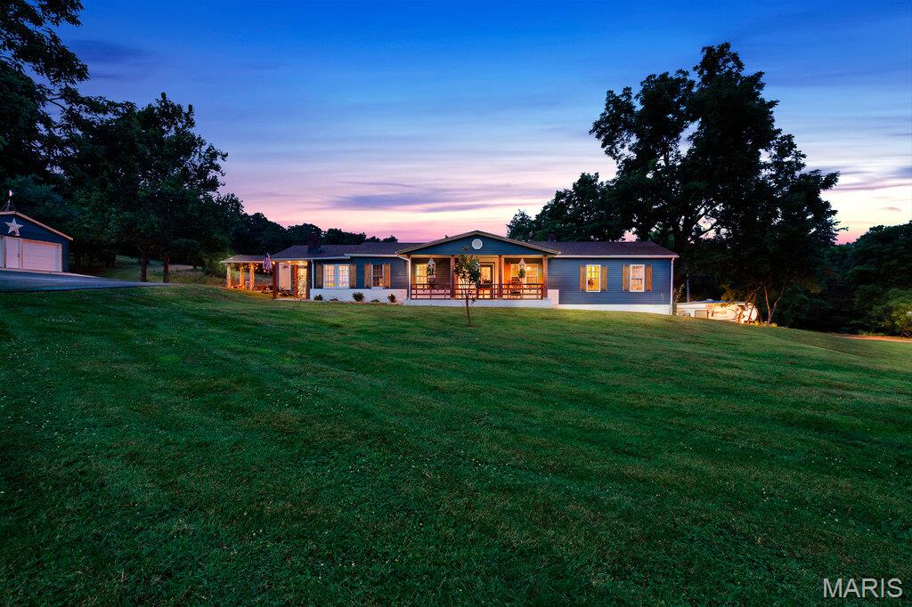 Welcome to 12272 Hyfield Road! Nestled on 8+ acres, 3-bedroom, 2-bath home offers the perfect blend of modern updates, functional space, and peaceful country living. With approximately 1,700 square feet of thoughtfully updated living space, this property is designed for both comfort and convenience.

Inside, you'll find a bright, inviting floor plan featuring updated flooring, fresh paint, a beautifully refreshed kitchen with modern finishes, renovated bathrooms, and spacious living areas perfect for everyday living or entertaining.

Step outside and discover everything this property has to offer. The 8-acre setting provides room to roam, garden, or simply enjoy the privacy and scenic surroundings. A barn offers excellent space for livestock, hobbies, storage, or equipment, while the oversized detached garage provides ample room for vehicles, a workshop, recreational toys, or additional storage.

Whether you're dreaming of a hobby farm, need space for your outdoor lifestyle, or simply want to enjoy the peace and quiet of country living, this property delivers. Conveniently located just minutes from De Soto, you'll enjoy the best of both worlds—rural tranquility with easy access to schools, shopping, dining, and major highways.

Don't miss this rare opportunity to own an updated home on 8+ acres with a barn and oversized garage. Schedule your private showing today!