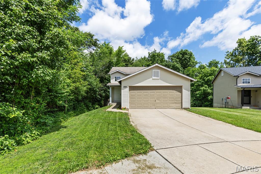 Charming Split Level Home on Private Cul De Sac with incredible patio and fenced in yard! Inside you will find updated flooring throughout, complemented by fresh baseboards, trim, and updated doors with modern hardware. Spacious living great room! Kitchen offers ample counter and cabinet space. Breakfast room leads to your incredible stamped patio and private fenced yard! Upstairs, you’ll find 3 spacious Bedrooms and 2 updated full baths. The spacious two-car garage provides convenience and extra storage. All in the boundaries of the Fort Zumalt School District and seconds from I-70 and 64.