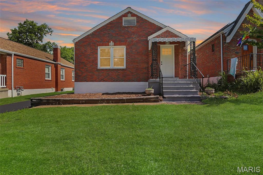 Welcome to this beautifully updated South City bungalow, where timeless character meets modern style and convenience. Step inside to find gorgeous hardwood floors, abundant natural light, and a spacious living room centered around a charming fireplace, creating a warm and inviting atmosphere. The adjoining dining room offers the perfect setting for everyday meals or entertaining guests.

The renovated kitchen is sure to impress with white shaker cabinetry, sleek quartz countertops, stainless steel appliances, a striking marble-look backsplash, and ample prep and storage space. Just off the kitchen, you'll find a versatile bonus room filled with natural light that would make an ideal sunroom, cozy lounge area, reading nook, home office, or play space.

Two comfortable bedrooms provide flexibility for family or guests, while the updated full bath features a stylish vanity, modern fixtures, and a beautifully tiled shower/tub surround. The walk-up unfinished basement provides excellent storage and offers incredible potential to expand your living space with a future recreation room, home gym, office, or hobby area.

Outside, enjoy the convenience of a private driveway providing valuable off-street parking in addition to the detached 1-car garage. The level, fenced backyard offers plenty of space for pets, play, or gardening and is complemented by a patio that's perfect for outdoor dining, entertaining, or relaxing with family and friends. Located in the heart of South City, you'll love being just minutes from neighborhood parks, local restaurants, shopping, and all that city living has to offer. This move-in-ready gem blends classic bungalow charm with thoughtful updates you won't want to miss!