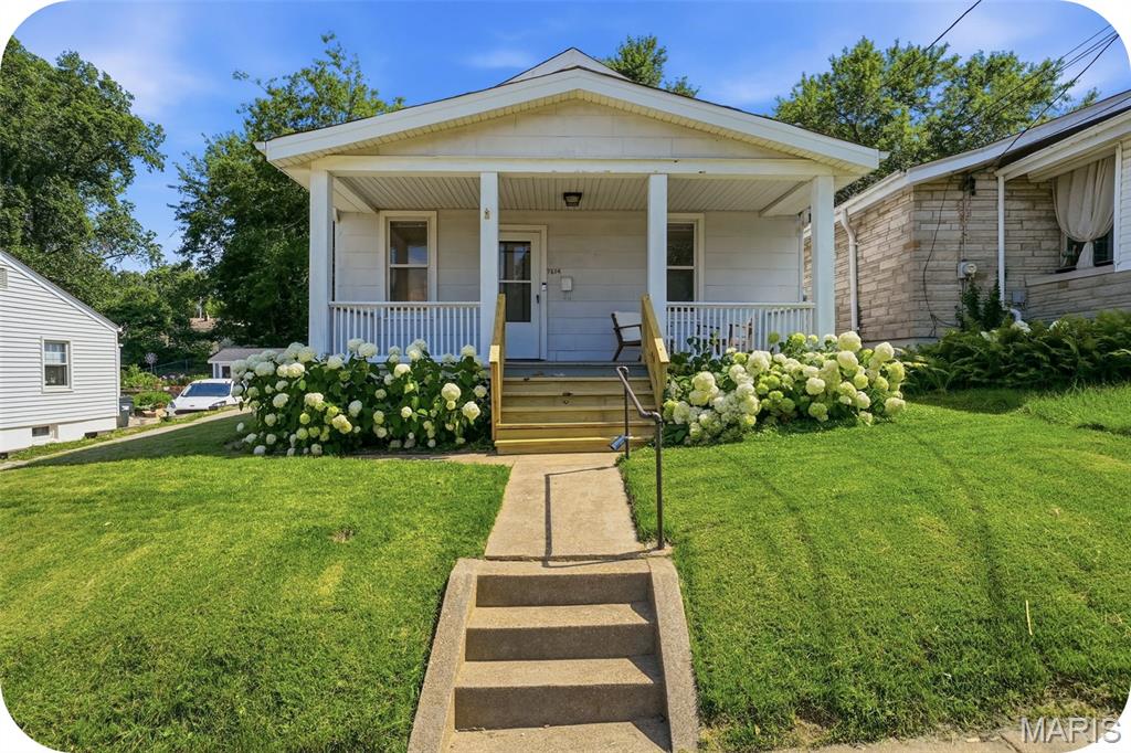 Welcome to this charming home in highly sougt-after Maplewood! From the moment you arrive, you'll be captivated by the inviting front porch--perfect for enjoying your morning coffee or relaxing at the end of the day. Step inside and discover a home filled with warmth, character, and thoughtful updates. Beautifully restored original hardwood floors flow through the living room, dining room, and both bedrooms creating a timeless appeal. The stylishly updated kitchen is full of charm, featuring open shelving, newer appliances, and plenty of personality--all appliances included with the sale. The recently renovated bathroom offers classic elegance with updated finishes. Just off the kitchen, the enclosed porch provides the perfect mudroom or drop zone for coats, shoes, and gardening gear, with convenient access to the basement, where you'll find laundry hookups and abundant storage space. Outside, the sun-filled backyard is a gardener's dream, offering endless possibilities for flowers, vegetables, or simply enjoying the outdoors. Entertain family and friends on the spacious patio, ideal for summer barbecues and gatherings. A private driveway leads to a convenient two-car garage. Move right in and enjoy everything this delightful home has to offer, all in an unbeatable location close to parks, shopping, dining, and neighborhood amenities.