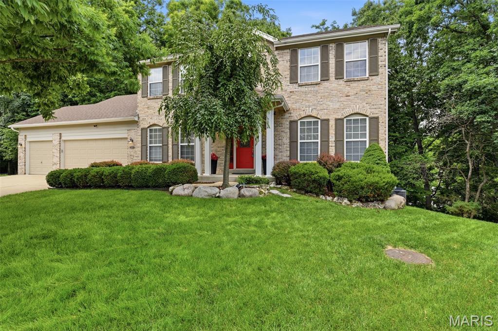 Private wooded sanctuary meets West County luxury. Nestled at the end of a quiet cul-de-sac in the sought-after village of winding trails, this executive two-story residence offers an unparalleled blend of sophistication and absolute privacy backing to dense forest with no rear neighbors. A grand two-story entry foyer with dual staircases introduces a light-filled floor plan framed by vaulted ceilings, classic built-ins, and a family room anchored by a brick-veneer fireplace. The premium kitchen island features granite countertops, a walk in pantry, and seamless flow to a spectacular party sized deck designed for effortless outdoor entertaining overlooking a serene backdrop. 
The upper level features spacious bedrooms including a jack-and-jill bath layout, while a bright architectural skylight cast a warm, natural glow from above. An exceptional secondary living space awaits in the deep 9ft+ pour walk out lower level, fully outfitted with a massive recreation room, full wet bar, bath and a private bedroom suite.
Premium peace of mind updates include a newer range/stove and oven appliances (2023) and integrated gutter guards, while a pre installed radon mitigation system provides effortless comfort.
Beyond the property line, enjoy a premier lifestyle with exclusive access to the private neighborhood clubhouse, tennis courts, and community pool, all just moments from Wildwood Town Center's fine dining, boutique shopping and scenic trails.