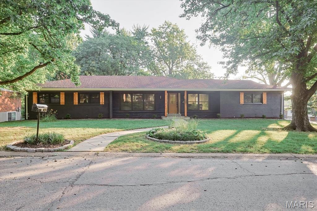 LOCATION is key! Ladue Schools! Stunning, fully renovated ranch with everything NEW — Brand New and refinished Hardwood flooring throughout first floor, elegant light fixtures, brand new plumbing & electric all throughout, EV charger ready, new ductwork, new windows, new doors, and new bathrooms! Step inside to gorgeous formal living and dining rooms that open to a sunlit family room with a gas fireplace. Culinary dream kitchen shines with new luxury appliances, quartz counters with pennsulia, a marble backsplash, custom soft-close cabinetry. The primary suite offers his-and-hers closets, a glass walk-in shower, and dual vanities, with two additional bedrooms completing the main level. And there's more — a multi-generational suite and study downstairs with a newly built full bathroom! Enjoy the 2-car garage, plenty of yard space with patio, and fresh landscaping, all just minutes from popular shopping, dining, and new developments all around. What are you waiting for? Don't miss this move-in-ready gem!