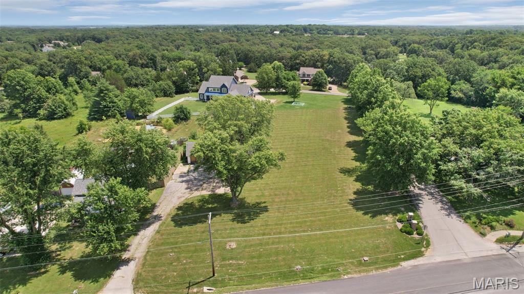 Prime opportunity in the heart of New Melle! A blank canvas for your next venture with this highly visible, level lot offering frontage on both Highway Z and Francis Street. With electric already onsite and flexible zoning potential, the possibilities are endless. Nestled in the heart of charming downtown New Melle, this location provides the best of small town living with the benefit of increasing visibility and traffic. Secure your spot in one of the region's most up and coming areas and watch your investment grow alongside the community. Property is agent owned.