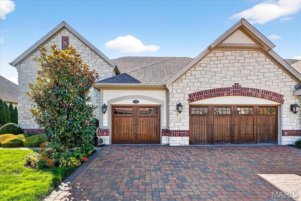 Enjoy life in luxury at The Villas at Meadowbrook, an exclusive community nestled along the 6th and 9th holes of Meadowbrook Country Club. With your choice of lake or golf course views, every home here is designed to offer a perfect balance of sophistication, comfort, and maintenance-free living. This Canterbury 1.5 Story floor plan offers approximately 3,786 square feet on the main and upper levels with an additional lower level option, providing exceptional flexibility to suit your lifestyle. From the moment you arrive, you’ll appreciate the timeless architecture, refined craftsmanship, and elegant finishes that define this one-of-a-kind residence. Step inside to find a spacious open-concept floor plan that effortlessly blends formal and casual living. The great room features soaring ceilings, a statement fireplace, and expansive windows overlooking the serene golf course surroundings. The gourmet kitchen is a chef’s dream, offering high-end appliances, custom cabinetry, a large center island, and designer finishes throughout—perfect for both everyday living and entertaining. The main floor primary suite serves as a private retreat, featuring a luxurious spa-inspired bathroom with dual vanities, a soaking tub, a walk-in shower, and an impressive walk-in closet. Upstairs, you’ll find additional bedrooms and baths, each designed with comfort and style in mind. The loft area offers flexible space for a home office, reading nook, or media room, allowing you to truly customize your home to your needs. Every Canterbury home in this community begins with an elevated list of luxury standard features, ensuring that your new home is already outfitted with premium materials, stylish design elements, and high-performance systems. From the elegant millwork and designer lighting to the energy-efficient systems and top-tier finishes, this is a home that exceeds expectations. Enjoy maintenance-free living with professional landscaping and snow removal provided by the homeowners association, allowing you to spend more time doing what you love. Step outside and enjoy the private patio or take a short stroll to the nearby Meadowbrook Country Club, where members enjoy world-class golf, dining, tennis, swimming, and a vibrant social calendar. Located in the Parkway West School District and conveniently close to the best shopping, dining, and entertainment in West County, The Villas at Meadowbrook provide the ideal setting for refined yet easy living. Whether you’re downsizing, seeking a lock-and-leave residence, or simply ready to design your forever home, this community offers the perfect blend of elegance, convenience, and lifestyle!