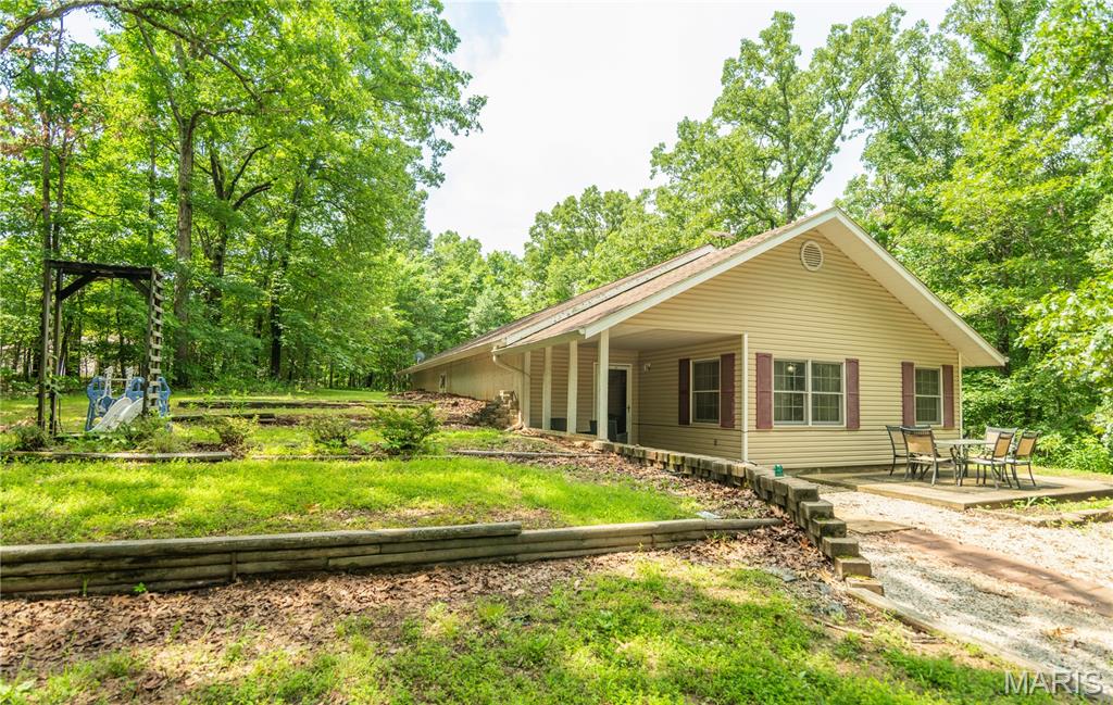 Nestled on 3.5+/- acres in the heart of the Lake Wappapello area, this unique 2-bedroom, 2-bath earth home offers comfort, privacy, and convenient access to some of the area's best outdoor recreation. Inside, you'll find an open floor plan with a spacious living area, large dining room, and an oversized primary suite designed for comfort and functionality.

The property also features an unfinished mother-in-law suite with an attached garage, providing excellent potential for additional living space, guest quarters, or a rental opportunity. A detached one-car garage offers additional storage for vehicles, boats, or outdoor equipment.

Conveniently located just minutes from Peoples Creek Boat Ramp, the public swimming and recreation area, Possum Creek Boat Ramp, and several other Lake Wappapello access points, this property is ideal for those who enjoy boating, fishing, and lake living. Whether you're looking for a full-time residence, weekend getaway, or investment opportunity, this property offers endless potential in a highly desirable location.