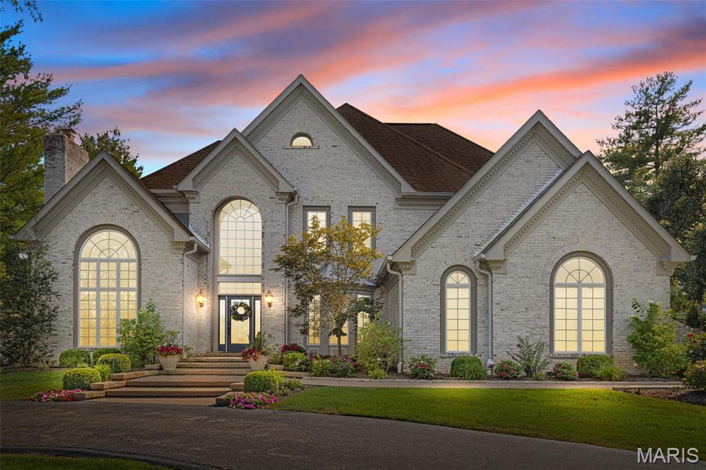 Your private retreat in the heart of Clarkson Valley! Stunning 1.5-story brick residence is filled with light and offers over 5,000 square feet of refined living space. With 5 bedrooms and 4.5 baths, every family member can enjoy their own private haven. The Beautiful Foyer is flanked by Vaulted living rm with gas FRPL and spacious dining rm. Impressive 2 sty G.R. accented by Fireplace, mirrored wet bar and view of the private outdoor spaces. Kitchen is stunning and equiped with top of the line appliances, surfaces, huge island and detailed cabinetry. Large Brkf Rm is bright with 3 sliding door and skylight. The main-floor owner’s suite is a true sanctuary, boasting a renovated spa-like bath, spacious walk-in custom closets, and a private composite deck overlooking the pool. Front and rear staircases lead to the 2nd floor with 3 B.R.s w/ custom closets, 2 baths and 9' ceilings. Walk-up finished lower level with 2300 sq.ft. Rec Rm w/ FRPL and huge wet bar. 5 fireplaces—4 indoors and 1 on the patio—this home blends warmth and elegance. Step outside to your resort-style backyard, complete with an in-ground, heated, saltwater pool and lush landscaping, is a year-round getaway. The patios provide ideal spaces for both relaxation and entertaining. Bamboo floors flow throughout the main level. Nestled on over an acre in a serene cul-de-sac, this home offers the perfect combination of space, privacy, and luxury. Impeccably maintained with extensive updates.