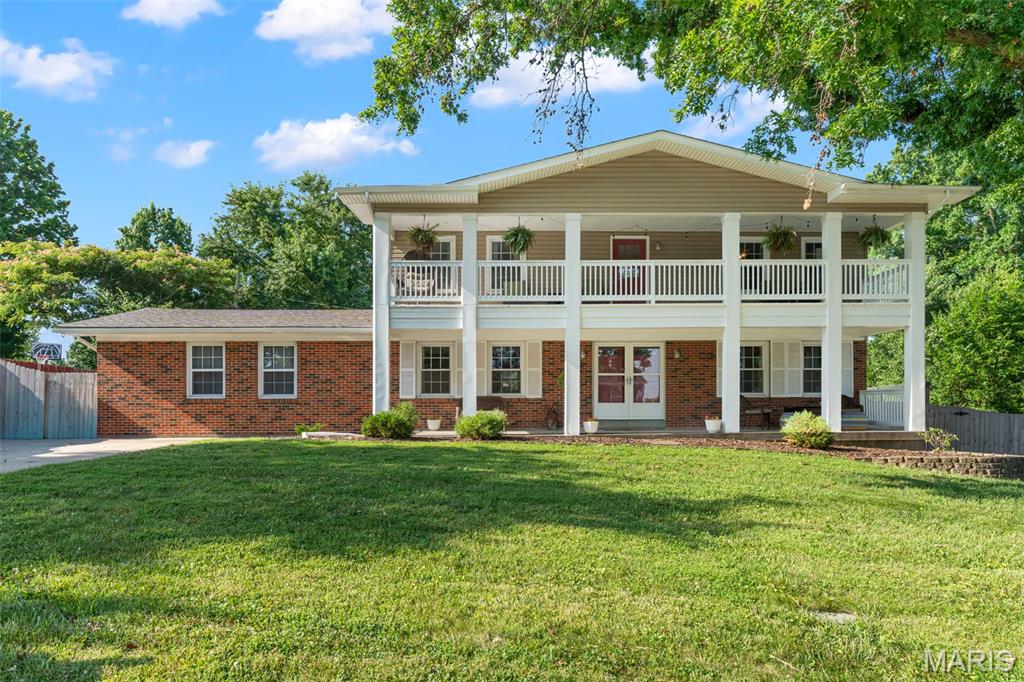 Simply Stunning! Step inside and prepare to be delighted!  Entering into the foyer you will find the Living Room to the right, formal Dining Room to the right.  Stairway to the upper level is located here as well.  The thoughtfully designed Kitchen is adjacent to the Dining Room and features beautiful custom cabinetry, stainless appliances and center island with seating.....perfect for grabbing a quick meal or snack.  Off the other side of the Kitchen you'll find the Hearth/Family Room with wood burning fireplace and on the opposite wall, plenty of custom storage and attractive wine rack.  This room walks out to big patio and level, privacy fenced yard.  Back inside and down to the partially finished lower/basement level there is a big Family and Rec Room area featuring wood burning fireplace.  This is a great flex space to utilize however you choose and has walk-up access to the back yard.  Don't forget the upper level balcony that spans across the front and the large 2-car, rear entry garage. There is plenty of additional parking as well.  Set your appointment today and say, "Yes!" to the address.