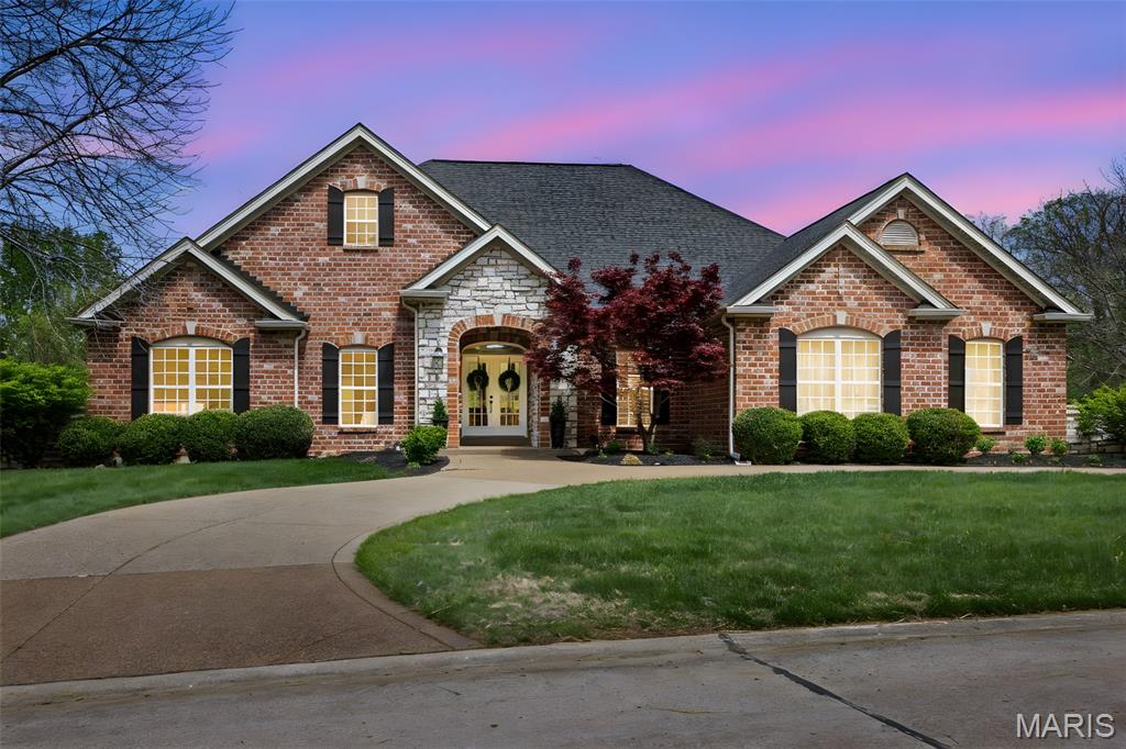 This extraordinary walkout ranch on a fabulous, level 1.08 acre lot in highly sought after Camelot offers over 5900 fin sq ft and an incredible open floor plan, that will have you ready to write an offer the moment you walk through the doors! The extensive remodeling of the entire home left nothing untouched! You'll love the entry area w/decorative but subtle wallpaper, and the sweeping views from your wall of windows in the great room, showcasing your private 1 acre lot! The kitchen is an absolute showstopper! Custom cabinets & vent hood, gorgeous marble backsplash, 10' island w/3" thick quartz countertops & double garbage pull outs, 36" gas cooktop w/pot filler, w/upgraded newer appliances incl 60" built in fridge/freezer, double oven and the walk-in pantry of your dreams with a built-in pebble icemaker, sink, quartz countertops, built in microwave and custom shelving & trimwork! Custom upgrades include engineered hardwood floors throughout most of the main level, 5 1/2" baseboards, upgraded newer light fixtures and all new doors/door hardware (2023), an entirely repainted home, premium carpet, and custom wallpaper accents! Multiple living areas on the main level include a huge great room with a gorgeous floor-to-ceiling brick fireplace as well as the hearth room with another stunning fireplace and built-in desk area perfect for work or games! Spacious dining area for even the largest table! Fabulous custom wall of display cabinets leads you to the amazing primary suite with a bay window and a stunning bath with a soaking tub, tile shower with dual heads, custom tile work, and an awesome walk-in closet. Two additional very spacious bedrooms with walk-in closets and closet organizers, as well as a beautifully updated full bath! Even the main floor laundry, got an amazing facelift with custom tile floors, granite counter, deep sink, cabinets, and decorative glass insert door! The finished lower level almost doubles the finished living area of the home! A huge family room set up with Dolby Atmos theater speakers and accent walls and lights, game table area, gorgeous bar/kitchenette area! Offering two huge bedrooms with large walk-in closets, with one being an amazing en suite! Plus a second full bath in the lower level with all the custom details. Don't miss the exercise room and finished storage area under the steps that could also make a perfect playhouse or gaming area for the kids! Huge deck overlooks the amazing privateNew roof 2025, dual high efficiency HVAC systems and tankless water heater! Upgraded and expanded electrical panels and exterior doors! Oversized, fully finished & insulated 3 car garage w/new garage doors 2025, updated gdo motors, more! Huge floored attic space over garage w/steps offers tons of extra storage! Lot is perfect for a pool, buyer had intentions of adding one! All this and more in desirable Camelot offering 3 lakes & walking trails, and highly rated Francis Howell Schools!