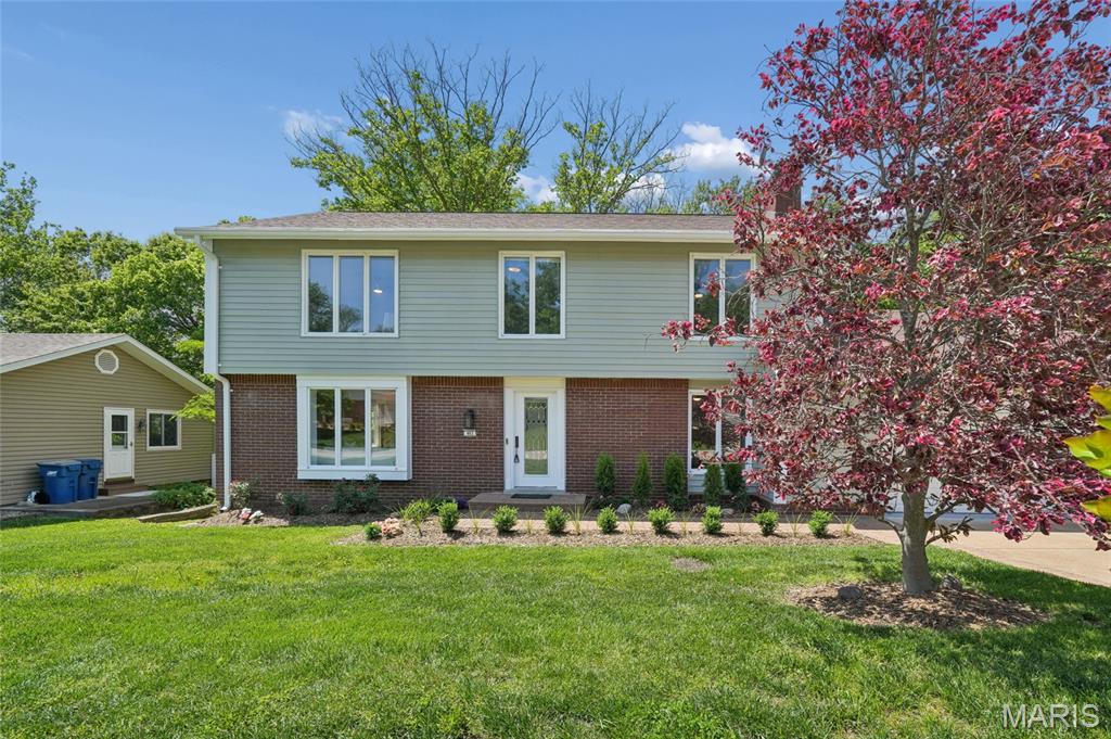 Your home search ends here! This beautifully remodeled 2-story home with a walkout lower level is ready for you to move right in. Blending modern comfort with timeless updates, this “next gen” home is perfect for extended families with over 3600 square feet of finished space. Gleaming hardwood floors guide you through spacious and natural light-filled living areas, modern accents, and recessed lighting. The custom designed kitchen is a true showpiece — featuring new quartz countertops, new stainless-steel appliances, and new elegant cabinetry designed with a built-in pantry for both beauty and function. Enjoy the breathtaking view of your private backyard and peaceful stream right from the kitchen sink. Step outside to upper or lower outdoor living areas for dining and entertainment. Upstairs boasts a stunning primary suite and ensuite bath with three generous bedrooms and a bathroom. The finished walk-out lower level adds impressive versatility, complete with a study, a full bath, designated kitchen area (with microwave/air fryer), a grand flex room for recreation, storage galore and plenty of space to sleep! The oversized garage includes epoxy flooring and a built-in workspace. This home offers style, comfort, and abundant living space in one beautiful package!