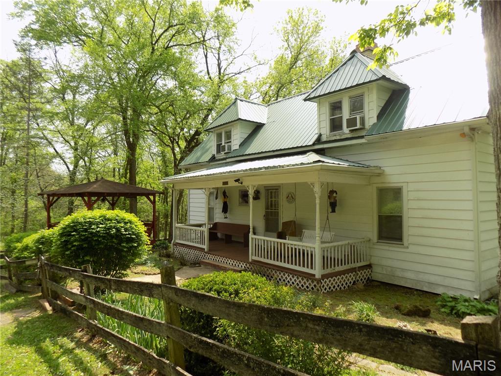 Gorgeous country setting,formerly part of Lost Trail Lodge, this 44 acres is located on the banks of  Black River, with an older farm cottage  built around  1900 overlooks the river and tucked away on private road, with beautiful view of hills and meadows with  Black River,and sand bars, bordering the south edge of property,  with great swimming holes.  The older farm home has 4 bedrooms, and 2 baths built around 1900, and retains that relaxing character, has a large barn for your  horses or animals.  There is a landing strip used by the previous owner next to the river! You'll love the quiet and privacy of  this property.! Comes with most all furnishings, and even a tractor for maintenance and canoe to enjoy the river!..Take a look at this one a place for the whole family to enjoy!