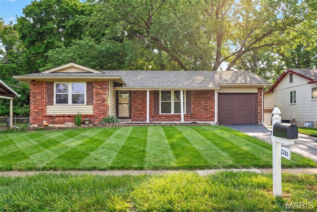From the moment you arrive, you'll appreciate the attractive brick veneer exterior, inviting curb appeal, and brand-new roof. Inside, this move-in-ready home offers fresh carpeting, updated paint, spacious living areas, and a well-appointed kitchen featuring stainless steel appliances. The HVAC system was replaced in 2020, providing added peace of mind. The partially finished lower level expands your living space and includes a versatile bonus room perfect for a home office, fitness area, playroom, or guest retreat. Step outside to enjoy the fenced backyard, which is ideal for entertaining, pets, or simply relaxing in privacy. Location is everything, and this home delivers! Situated just steps from the Maryland Heights Community Center and minutes from major highways including I-270, I-70, and Highway 364, you'll enjoy effortless access to shopping, dining, parks, entertainment, and everything St. Louis has to offer. Located within the highly acclaimed Parkway School District, this home combines comfort, convenience, and exceptional value in one desirable package. Don't miss your opportunity to make this Maryland Heights gem your next home! Floor plans located at end of photographs.