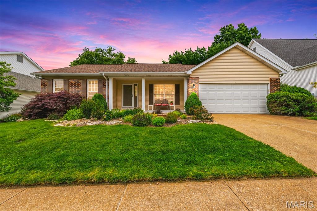 From the moment you arrive, this beautifully maintained home offers a warm and inviting presence. The spacious covered front porch provides the perfect setting for morning coffee, quiet evenings, or welcoming guests. Inside, the thoughtfully designed floor plan blends functionality with elegance. Upgraded wood flooring flows throughout the main living areas, while the vaulted ceiling in the living room creates an open, airy atmosphere. A fireplace framed by two large windows serves as the focal point of the space, offering beautiful views of the expansive backyard and filling the room with natural light. A sunken office, privately situated away from the main living areas, provides an ideal space for working from home, studying, or managing daily tasks with added privacy and focus. The separate dining room is perfectly suited for both formal entertaining and everyday gatherings. The spacious eat-in kitchen features upgraded cabinetry with abundant storage and ample room for casual dining. A main-floor laundry room adds everyday convenience to a busy lifestyle. The primary suite offers exceptional space and comfort, complete with a private bathroom featuring a double vanity, soaking tub, separate stand-up shower and a large walk-in closet. Two additional main-level bedrooms are generously sized and feature brand-new carpeting. Descend to the lower level, where opportunity awaits. Beyond the finished room already in place, the basement offers dedicated storage, workshop space, a utility area, and an enormous unfinished footprint ready for whatever comes next. Home theater, game room, fitness space, additional bedrooms, entertaining area--the possibilities feel endless without sacrificing valuable storage. Outside, the private patio and expansive green space create a backyard that feels more like a retreat than a typical subdivision lot. The setting is exactly what buyers envision when they picture an established neighborhood done right: wide lots, mature shade trees, peaceful streets, and room to breathe.