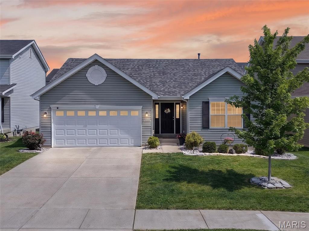Welcome home to this inviting 3-bedroom, 2-bath ranch featuring a bright, open floor plan with soaring vaulted ceilings. From the moment you step inside, you'll appreciate the seamless flow between the living room, breakfast room, and kitchen, complemented by beautiful wood laminate flooring that combines the timeless appeal of hardwood with everyday durability.
The kitchen is highlighted by a breakfast bar, tall upper cabinets, a large single basin sink, and stainless steel appliances, including a newer dishwasher (2024). The spacious living room offers a comfortable gathering space, while the breakfast room is filled with natural light and features sliding glass doors leading to a large stamped concrete patio. Surrounded by beautiful landscaping and overlooking the fenced backyard, this outdoor retreat is perfect for relaxing or entertaining.
The primary suite features a striking accent wall, a walk-in closet, and a private bathroom with dual sinks. Two additional bedrooms provide flexibility for a variety of needs, including one accented with charming wainscoting.
The 2-car garage includes an 8' x 5' bump-out, offering valuable space for storage, hobbies, or a workshop area. Additional updates include a new roof installed in 2024, providing an important improvement to the home.
The unfinished lower level features an egress window and a bathroom rough-in, offering outstanding potential for future living space, recreation areas, a home office, or additional storage.
Enjoy the added benefit of neighborhood amenities including walking trails, pickleball courts, and pavilions, creating wonderful opportunities to enjoy the outdoors.
Combining an open layout, quality updates, desirable amenities, and room to grow, this move-in ready home is ready to welcome its next owner.