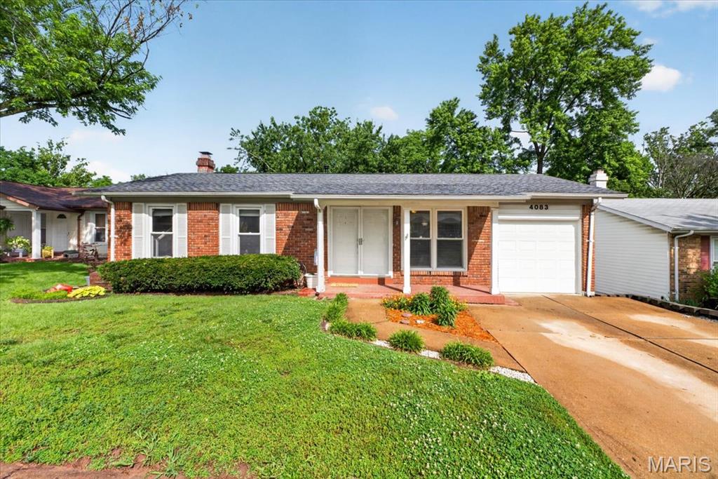 This home truly offers the best of both worlds—convenient location and peaceful privacy. Situated in Oakville near I-270 and I-255, you’re just minutes from shopping, dining, and easy interstate access. Yet step into the backyard and enjoy a private, wooded setting where birdsong provides the perfect soundtrack for spring mornings on the deck. Inside, the open-concept floor plan is ideal for entertaining or relaxing together at the end of the day. The walkout basement features a spacious family room with a cozy fireplace, perfect for gatherings or quiet winter evenings by the fire. Upstairs, you’ll find three inviting bedrooms and two full bathrooms with modern finishes. Gorgeous hardwood flooring flows through nearly every room on the main level, adding warmth and style throughout. The roof is just one year old, offering peace of mind for years to come. Located in the Oakville High School attendance area, this home checks all the boxes. Schedule your showing today—this one won’t last long!