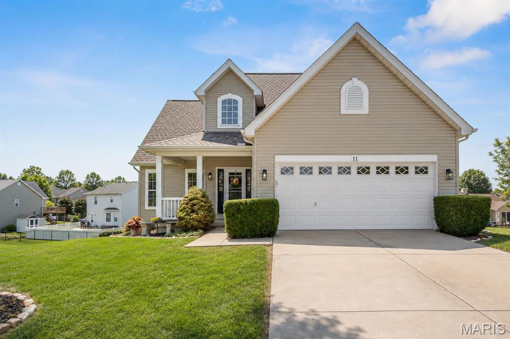 START PACKING! You are going to fall in LOVE with 11 Towergate Ct, Lake St Louis, MO 63367! Tucked in one of the most sought after subdivisions, Wyndgate, is the cutest 1.5 story home. This former model home has been immaculately maintained by its ONLY owners and is move in ready! You'll love the safety and privacy of being at the end of a cul-de-sac and in walking distance to the pool! Step in to see the vaulted living space, all new LVP floors, and a cozy gas FP. Large breakfast room leads you right into the spacious, renovated kitchen! Brand new quartz countertops accent the 42" cabinets overlooking the HUGE quarter acre lot. Your yard is sure to stay green with the in-ground sprinkler system! On the main level, you'll find the large primary bedroom with tray ceilings, brand new carpet and a walk-in closet! Primary bathroom has a dual sink vanity, large soaking tub and separate tub! The main floor also offers a powder room, main floor laundry & access to 2 car garage! Upstairs is where you will find 2 additional, great size bedrooms and a loft (could easily be 4th bedroom)! The guest bathroom also has a dual sink vanity along with a tub/shower combo! Make your way to the completely finished lower level to find brand new (and the cutest!) carpet and 9' ceilings offering another entire entertaining space and 3rd full bathroom! With multiple full-size windows and a walkout, all this space is livable and could easily be transformed into another bedroom. Host and entertain easily with the dry bar, wine chiller, back patio or upper deck! Love outdoor activites? Enjoy the neighborhood amenities like the pool, pickleball courts, basketball courts, or ponds!!! The future buyer can have peace of the mind that all the systems have been meticulously taken care of: Roof is 4yrs, HVAC is BRAND NEW, updated vinyl windows and window treatments throughout the house! Incredible schools and family friendly neighborhood with tons of events! Garage shelving and ALL appliances stay with the home, including the washer and dryer! There's nothing to do but unpack and enjoy all that this property has to offer!!!!