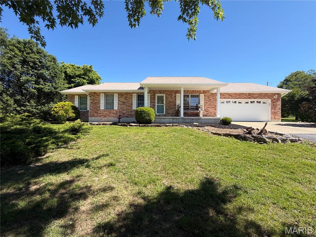 Beautiful brick home situated on 9+ acres offering the perfect blend of peaceful country living with the convenience of being just minutes from town. Property features a paved driveway, beautiful landscaping, and breathtaking panoramic views. In addition to the attached amenities, the property includes a large 1,680 sq. ft. detached metal garage/shop ideal for storage, hobbies, equipment, or workshop space. A rare opportunity to enjoy privacy, space, and stunning scenery all in one property.