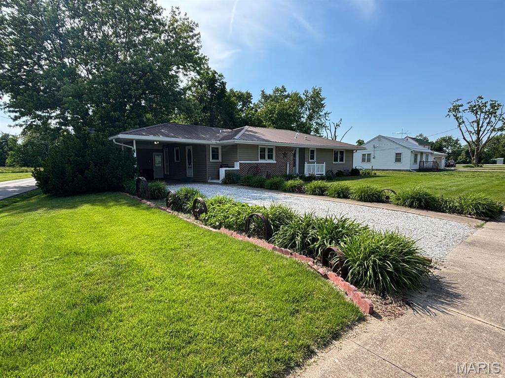 Beautifully Updated Home Near Mark Twain Lake

Welcome to 215 S. Oak Street in Monroe City, MO! This charming and well-maintained 1,524 sq. ft. home offers comfortable one-level living in the heart of Monroe County, just a short drive from Mark Twain Lake.

Featuring 2 spacious bedrooms, 1.5 bathrooms, a carport, detached shop/garage, garden area, and a fenced backyard, this property has so much to offer inside and out. The inviting kitchen provides great functionality for everyday cooking, while the formal dining area is ideal for hosting and entertaining. Warm interior colors, thoughtful updates, and a welcoming layout make this home move-in ready.

Situated on a corner lot, the large fenced backyard features mature trees that offer shade, privacy, and plenty of outdoor enjoyment. Whether you are looking for small-town living, extra outdoor space, or convenient access to boating, fishing, and recreation at Mark Twain Lake, this home checks all the boxes.

Schedule your showing today and see all that this Monroe City home has to offer. See it! Love it! Own it!