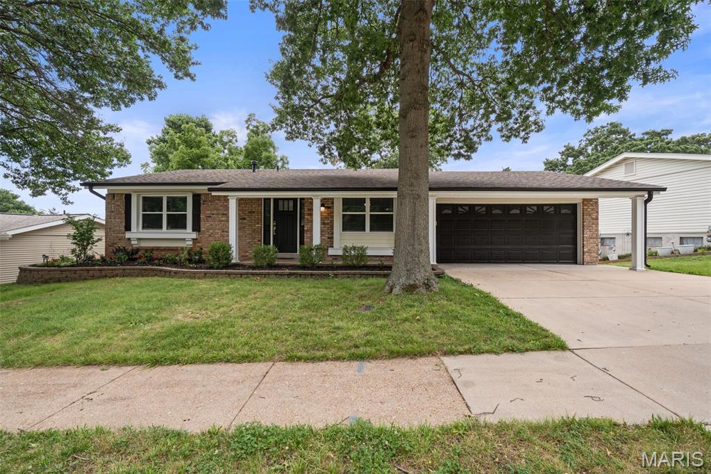 Completely renovated from top to bottom, this stunning Ballwin ranch is truly move-in ready! Located on a quiet street with a beautiful neighborhood pond and within the highly sought-after Parkway South School District, this 3-bedroom, 2-bath home has been thoughtfully redesigned with quality finishes throughout.

Inside, you'll find a spacious living room, a separate dining room, and a beautifully renovated kitchen featuring brand-new cabinetry, quartz countertops, stainless steel appliances—including a refrigerator, gas range, microwave, dishwasher, and beverage refrigerator—and modern finishes throughout.. The private primary suite offers a walk-in closet and a fully renovated bathroom.

Just off the kitchen, step onto the deck overlooking the large, level backyard. An added bonus is the finished attached flex space at the rear of the garage, complete with drywall, finished flooring, and lighting—perfect for a home office, hobby room, workshop, workout space, playroom, or extra storage.
The finished walkout lower level provides expansive recreation space along with a beautifully finished laundry room and ample extra storage!

The updates are extensive, including all new windows (even in the basement), new doors, all new flooring, all new lighting, beautifully renovated bathrooms, custom woodwork around the windows and doors, updated landscaping, gutter guards, a newer roof (approximately 2 years old), a new 200-amp electrical panel, and a sewer lateral that has been scoped and repaired in conjunction with the City of Ballwin. Even the attached two-car garage has been finished with drywall and epoxy flooring.

Beautiful renovations, a fantastic location, and truly move-in ready—this is one you won't want to miss!