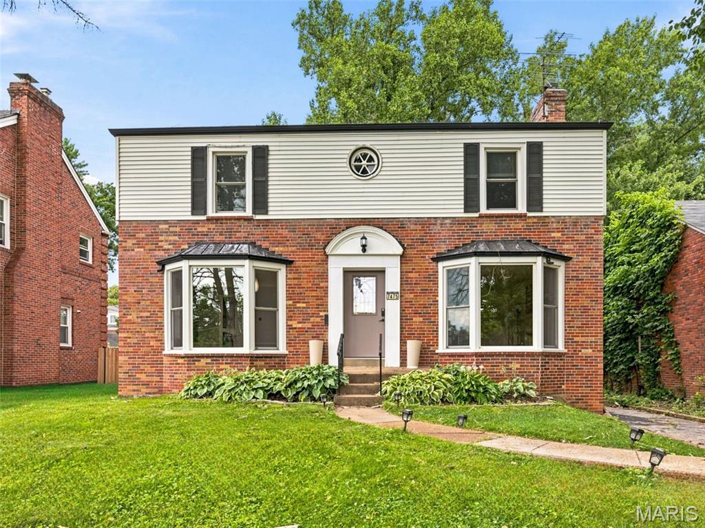 Charming and full of character, this beautiful 2-story home sits in the heart of University City directly across from UCity High School and just minutes from The Loop, Clayton, Ladue, Creve Coeur, and more. Rich wood flooring flows throughout the main living areas and all upstairs bedrooms, complemented by timeless 1940s details including coved ceilings, arched doorways, custom molding, and built-ins. The spacious living room features wood floors, a bay window, fireplace, built-ins, and French doors leading to a screened-in deck—perfect for relaxing or entertaining. The large dining room offers wood flooring, a bay window, updated chandelier, and fresh paint. The newly remodeled kitchen is a showstopper with granite countertops, a sink overlooking the backyard, and an incredible custom butler’s pantry. A newly remodeled half bath completes the main level.

Upstairs, the primary suite features wood floors, double closets, abundant natural light, and French doors opening to a private screened-in balcony. Two additional generously sized bedrooms offer wood flooring, including one with a large walk-in closet. The fully remodeled full bath includes a separate shower and soaking tub.

The walk-up basement provides convenient access to the backyard and features a laundry area with a handy laundry chute, along with plenty of space for storage. Additional highlights include a partially fenced private backyard, two-car detached garage, and newer windows, roof, siding, water heater, and HVAC. A rare opportunity to own a home that blends timeless architecture with thoughtful updates in one of UCity’s most desirable locations.