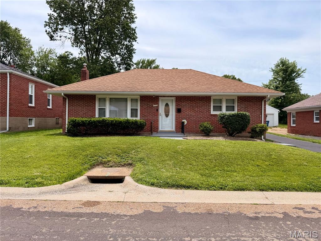 Welcome home to this well-maintained 3-bedroom, 2 full bathroom ranch offering comfort, updates, and outstanding curb appeal. Nestled on a peaceful dead-end street, this property provides the privacy and convenience today's buyers are looking for.

From the moment you arrive, you'll notice the attractive brick exterior, neatly trimmed hedges, and freshly sealed asphalt driveway that create a welcoming first impression. The home features vinyl windows and a roof that is less than five years old, providing peace of mind for years to come.

Step inside to discover a bright and inviting interior featuring fresh gray and white paint throughout, creating a clean, modern feel that is move-in ready. The functional floor plan offers comfortable living spaces, three spacious bedrooms, and two full bathrooms designed to accommodate a variety of lifestyles.

The kitchen provides plenty of storage, including a convenient pantry to help keep everything organized and within reach. Whether you're preparing everyday meals or entertaining guests, you'll appreciate the practicality of this space.

Outside, enjoy the privacy of the partially fenced backyard featuring a 6-foot privacy fence—perfect for outdoor gatherings, gardening, or simply relaxing in your own private retreat.

Car enthusiasts, hobbyists, and anyone needing extra storage will love the oversized detached garage. This impressive space features electric service, a concrete floor, a newer aluminum garage door, and a garage roof that is only six months old. Whether you're looking for a workshop, additional storage, or secure parking, this garage delivers exceptional versatility.

If you're searching for a solid, well-cared-for home with valuable updates, plenty of storage, and a peaceful setting, this ranch is one you won't want to miss. Schedule your private showing today and see everything this wonderful home has to offer!