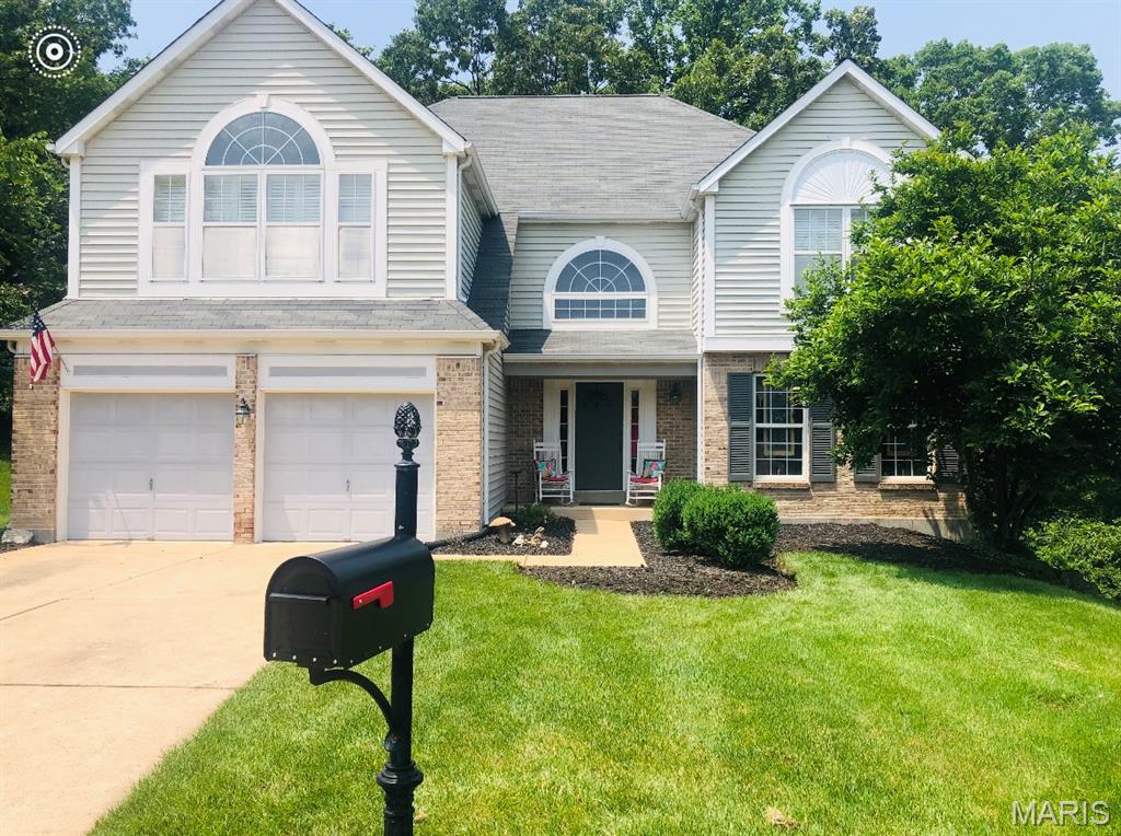 This beautiful 2-story traditional home is ready and waiting for the new buyer's personal touches and updates. Located on a premium lot on a quiet cul-de-sac in the highly sought after Rockwood School District.  This open concept floor plan features 4 spacious bedrooms, 2.5 baths, updated kitchen with quartz countertops, stainless appliances and tile flooring.  Cozy up to the living room fireplace with windows that overlook the gorgeous deck and beautiful wooded area.  The master bedroom features a luxurious ensuite with soaking tub, walk in shower and spacious walk-in closet.  Includes main floor laundry room, 2-car attached garage, and unfinished walkout basement.  Seller to include 1 year home warranty.