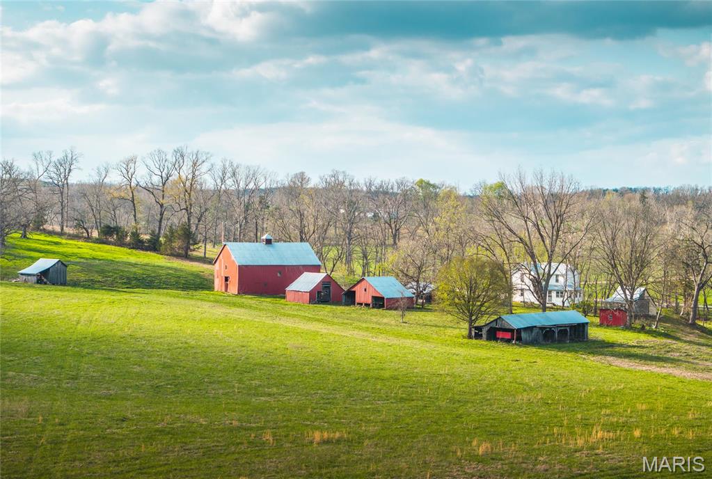 Nestled in the rolling hills of Maries County, MO, this remarkable 282-acre property is a dream come true for outdoor enthusiasts. With a diverse landscape that includes open hay fields, creek bottom row crop acreage, big blocks of hardwood timber bedding, and approximately 3/10th  mile of beautiful Maries River, this land offers endless opportunities for recreation and relaxation. The historic farmstead sits overlooking the Maries River and Keiser Creek, offering the potential for restoration as a rustic weekend getaway, base camp, or continue to lease for additional income. The row crop acreage not only adds to the scenic diversity of the property but also offers the option for income or habitat planting. Wildlife is abundant here—deer and turkey frequent the fields and woods, and the river provides a peaceful setting for fishing or cooling off in the summer. With its natural beauty, privacy, and variety of outdoor activities, this property is a rare find in rural Missouri.