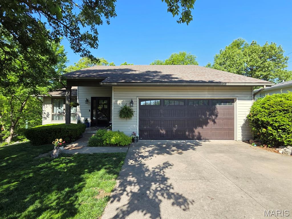 Such nice features here! You'll enjoy the open floor plan, cozy back porch, new deck, full basement, master suite & handy location 'on the hill' in Canton.  These are hard to come by - this completely move-in-ready home offers a spacious & sunny living/dining area that leads right to the kitchen, and all appliances (nearly new Samsung Bespoke) will convey.  An attached back porch/sitting room would also make an ideal home office, reading nook or the perfect spot to enjoy morning coffee overlooking the new back deck featuring a hot tub & BBQ area and a secluded, wooded back yard.  The oversized master suite offers plenty of room for big furniture, a walk-in closet and attached bath with walk-in tile shower.  You'll appreciate having the laundry area on the main level just off the master suite. The attached, oversized 2-car garage offers plenty of parking & additional storage/workshop space.

Upstairs you'll find two more bedrooms, a full bath and walk-in hall closet.  The full basement offers plenty of opportunity - you could easily add another 1-2 bedrooms here and still have a nice utility space to house the utilities and storage. The basement walks out to the private backyard overlooking the lake to the west.

Utility providers here include Liberty Gas, Ameren Electric, City of Canton water/sewer/trash, and both Rise & Brightspeed Fiber are available.