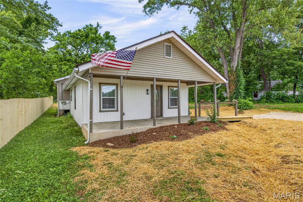 Completely remodeled and move-in ready! This charming 3 bedroom, 2 bath home at 703 W Main in Bismarck, Missouri offers a spacious open-concept layout perfect for everyday living and entertaining. The fully remodeled kitchen and dining area features new custom cabinets, new countertops, new appliances, and a beautiful tile backsplash. The large laundry room comes complete with washer and dryer included. Enjoy new flooring throughout, two full bathrooms, a cute covered front porch, and a nice lot with plenty of outdoor space. Don’t miss your chance to see this beautifully updated home!