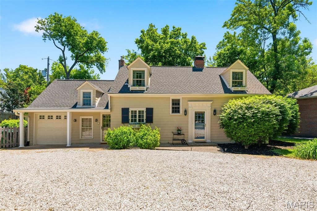 Historic charm and modern beauty adorn this 3 bedroom, 2.5 bathroom English Cottage in the heart of Glendale. From the dormers, the Dutch front door, hinged shutters and planter boxes, gravel driveway and flagstone walkway, this home has been thoughtfully cared for and decorated to bring together a modern living experience. The kitchen features a Dacor gas stove, microwave, gourmet ice machine, high end Corian counters, wet bar with copper sink from Mexico and beautiful custom cabinets. Hardwood flooring flows throughout the main level to a spacious dining room and living room with beautiful custom fireplace mantle, bay window and crown molding. Go up the main staircase you will find a primary bedroom with a full ensuite bath and spacious closet, which also connects to the second bedroom. The staircase off the kitchen leads to the third bedroom with 3/4 bath, perfect for out of town guests or in-laws quarters. The level, fenced backyard provides a perfect space to entertain and play, with a covered patio w/ outdoor TV, mature shade tress, lush landscaping and gardening shed. Additional features include a 1 car garage, laundry area w/ washer and dryer included, newer architectural shingle roof ('21) and gutters ('21), newer water heater ('23), dual electrical panels and freshly painted exterior ('24). Come see what this beautiful home has to offer!
