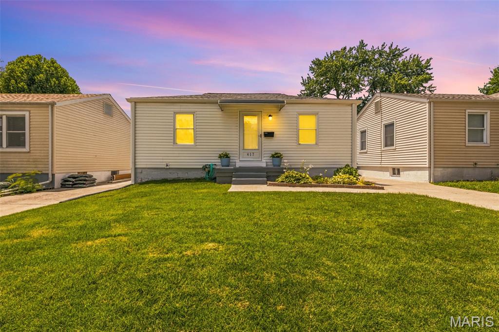 Tiny but Mighty—and Absolutely Adorable! Welcome to this move-in ready bungalow nestled in the heart of Frenchtown, where charm, updates, and location come together perfectly. This 2-bedroom, 1.5-bath home has been thoughtfully updated with new carpet and fresh paint throughout so you can simply move in and start enjoying everything it has to offer. Don't let the square footage fool you! The lower level offers two versatile bonus spaces perfect for a man-cave, playroom, home gym, office, hobby room, sleeping room or whatever fits your lifestyle. Step outside to enjoy the large backyard, offering plenty of room for entertaining, gardening, pets, or simply relaxing around a fire pit.
Major improvements include newer windows and blinds, water heater, roof, siding, exterior doors, plus an updated patio and driveway—giving you peace of mind for years to come. Best of all, you'll be just minutes from Historic Downtown St. Charles, with its award-winning restaurants, charming shops, festivals, riverfront, and year-round events.
This home truly proves that great things come in small packages. Come see why this tiny but mighty bungalow is the perfect place to call home!