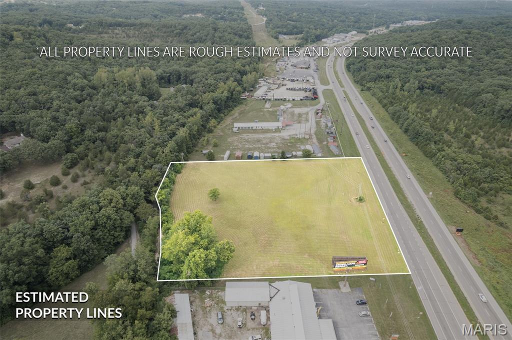 3.1 +/- acres located on Highway 67 near signalized intersection. Has 392 feet of road frontage, very flat, very high visibility, excellent traffic counts! Beautiful level lot has all kinds of potential uses. Many potential uses , Zoned CC2 Location: High Traffic, Highway/Interstate Frontage.