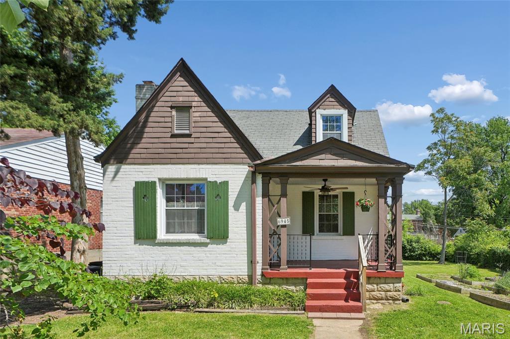 Charming three bedroom brick cottage in University City. Close to Heman Park and the Centennial Commons Recreation Center. Well maintained home on an oversized lot. Presently the east side yard is being used for a community garden. The new owner may continue to use it in that fashion or use it for their private use only. The delightful covered front porch is a wonderful space to enjoy a relaxing breeze with the help of the ceiling fan to circulate the air. You will find gleaming hardwood floors in the living room, dining room, and main floor bedrooms. Freshly painted main floor interior and many windows help to make the house bright and cheery. The fireplace is the focal point of the living room. Presently it is blocked off and non-functional .The extra convenience of a main floor laundry adds to the livability of the house. Access to the second floor stairs is thru the kitchen. Presently on the second floor you will find bedroom  three ( a garret bedroom) which does not have a closet. It is ideal for a guest bedroom or an office. Also upstairs you will find a LARGE unfinished space that provides a lot of expansion possibilities. There is plenty of room to put in an additional bedroom, bathroom and closet space. The lower level is an unfinished basement that provides an extra closet and shelving for storage as well as an outside access. This delightful home is just waiting for you to add your finishing touches and call it HOME.