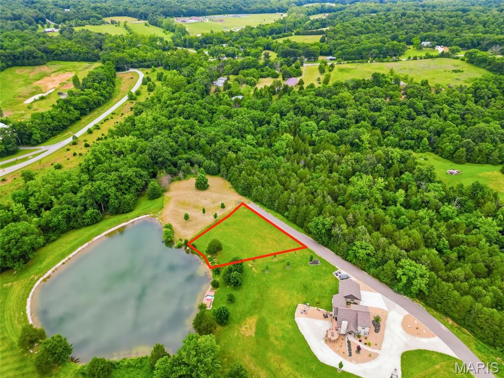 Discover the perfect setting for your custom cottage on this lakefront lot located in the new Tyrolean area of Innsbrook Resort. This picturesque, level lot spans almost an acre and backs to 12 acres of wooded common ground, offering a rare combination of waterfront living and added privacy with beautiful natural views and a peaceful, secluded atmosphere. With a minimum build requirement of 1,200 square feet, this homesite is ideal for creating a charming retreat or full-time residence tailored to your vision. Enjoy direct access to the water and embrace the Innsbrook lifestyle—morning fishing, kayaking from your backyard, afternoon hikes, and relaxing evenings with a glass of wine as the sun sets over the lake. A rare opportunity exists to purchase the adjoining lot at 2693Klor Lane, giving you nearly two acres and a substantial portion of the shoreline along the right side of the lake. The property features blacktop road access and is conveniently located near many of the resort’s premier amenities, including community pools, scenic lakes, hiking trails, a fitness center, pickleball courts, and the Amphitheatre. There is no required timeline to build, giving you the flexibility to plan at your own pace. Innsbrook serves as the exclusive general contractor, with thoughtful building guidelines in place to preserve the natural beauty and character of the community.  An exceptional opportunity to create your dream custom cottage in one of Missouri’s most sought-after resort communities.