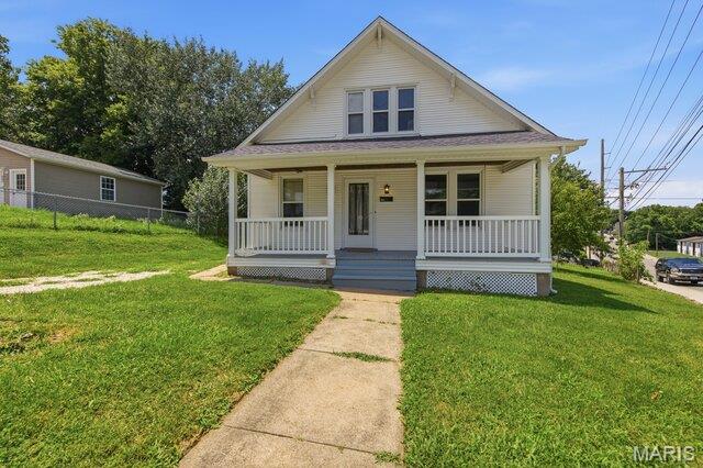 Charming 1940s Bungalow Loaded with Character and Space located in Downtown Washington!   This beautifully maintained 3 bedroom 1.5 bath home blends timeless craftsmanship with tasteful modern updates. refurbished original hardwood floors, fresh paint throughout, and modernized bathrooms, making this home move-in ready while preserving its historic charm.  1462 square feet of  spacious living areas, and stunning original details including push-button light switches, glass doorknobs, original hardware and millwork, French doors, an elegant arched entryway, and a beautiful bay window.  The large rooms provide plenty of space for family living, entertaining, or a home office. The kitchen features its original wood cabinetry, offering warmth and character with room to make it your own. Outside, enjoy a fenced backyard along with a detached outbuilding/garage that provides excellent storage, workshop space, or room for hobbies. If you're looking for a home filled with history, character, and thoughtful updates, this charming bungalow is one you won't want to miss!
