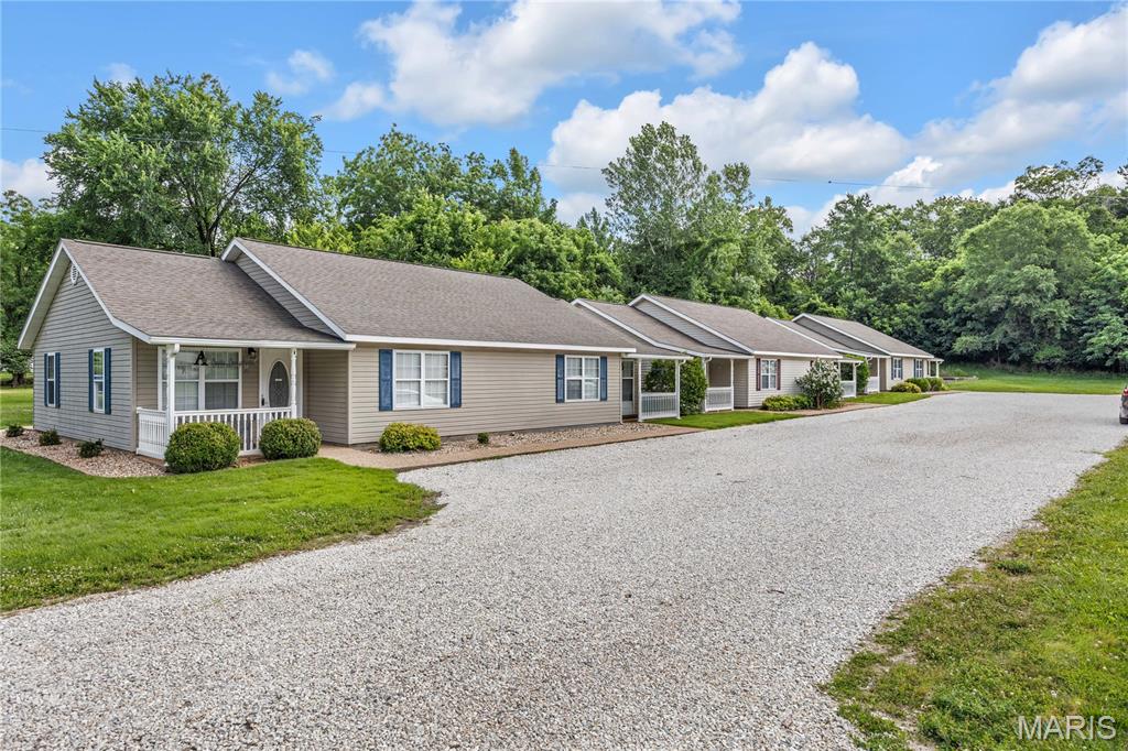 Excellent investment opportunity in Hermann, Missouri! This unique property features three duplexes situated on approximately 0.8 acres, with a concrete slab already poured and ready for a fourth duplex. Each of the six units offers 2 bedrooms, a full bath, laundry area, kitchen, and living room, along with a private front porch and rear patio for outdoor enjoyment. The level lot provides easy accessibility both inside and out, with parking conveniently located near each unit's entrance. Each duplex also features a centrally located maintenance room positioned between the two units, allowing easy access for repairs and upkeep without disturbing tenants. Currently operated as successful short-term rentals, the property also offers the flexibility to transition back to long-term housing. Located in Hermann, where demand for quality housing remains strong, this property presents an outstanding opportunity to expand your rental portfolio with immediate income potential and room for future growth.