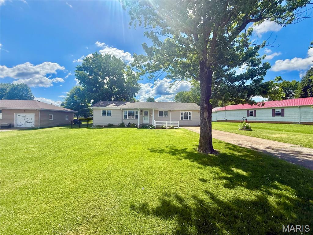 Welcome home to this spacious and well-maintained 3-bedroom, 2-bath ranch offering comfortable single-level living with room for everyone! Situated on a generous lot with a large backyard and a nicely sized front yard, this property combines functionality, charm, and plenty of space both inside and out. Step inside and you’ll immediately appreciate the beautiful natural hardwood flooring that flows throughout much of the home, creating warmth and character. The updated kitchen is perfect for any culinary artist and comes complete with all appliances, including the refrigerator, dishwasher, and stove. Just off the kitchen, you’ll find a cozy breakfast room ideal for morning coffee or casual dining. The home also features a spacious formal dining room that could easily serve as a secondary family room, game room, or entertainment space depending on your needs. Need additional flexibility? A bonus office area offers the potential for a fourth bedroom, hobby room, or home workspace. Storage will never be a concern with an incredible 11 closets located throughout the home, providing an abundance of space for clothing, seasonal items, and household storage. The large primary suite features its own walk-in closet and a spacious private bathroom, creating the perfect retreat at the end of the day. Additional features include a nice-sized laundry room, a brand-new HVAC system for year-round comfort, and a new hot water heater for added peace of mind. Outside, you’ll love relaxing on the covered front porch or entertaining guests on the private back patio. The backyard is fully enclosed with chain-link fencing, making it ideal for pets, children, or simply enjoying your own outdoor space. An impressive 8x12 storage shed with concrete flooring and existing 100-amp electrical service provides endless possibilities for a workshop, hobby area, or additional storage. Parking is convenient with off-street parking available both in the front and rear of the property. If you’ve been searching for a home that offers space, storage, updates, and versatility, this one checks all the boxes. Schedule your private showing today and see everything this wonderful property has to offer!
