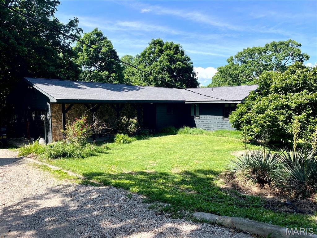 Home is selling absolute at Public Auction on Friday Night, July 10,2026. See website for more details
3 bedroom ranch home with a full walkout basement built in 1960. The home features a large kitchen, living room w/fireplace, 2 baths, main floor laundry, unfinished basement & attached 2 car garage & covered patio. The home has n FA furnace, is presently heated by electric baseboard heat & window unit for air. The home is on city water w/septic, not hooked into city sewer. The exterior of the home has painted cedar shake type siding & stone with shingle roof, large wooded lot backs to McClean Creek, big mature trees.
