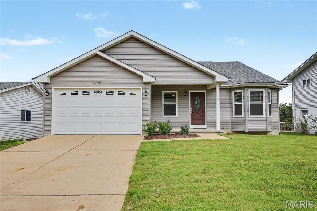 Move-in ready and exceptionally maintained, this 4-bedroom, 3-bath ranch offers the perfect blend of modern design, quality construction, and comfortable living. Built in 2014, the open floor plan creates an inviting atmosphere with a spacious great room that flows seamlessly into the kitchen and dining area, making everyday living and entertaining effortless. The kitchen is thoughtfully designed with abundant cabinetry and generous counter space. The main level features a private primary suite with a walk-in closet and en-suite bath, a second bedroom, and an additional full bath, creating a functional layout for everyday living. The finished lower level expands the home's living space with two additional bedrooms, a full bath, a spacious recreation room, dedicated laundry area, and a separate wood shop/storage room. The 9-foot pour basement provides the same sense of openness found throughout the home while offering exceptional flexibility and organization. Outside, enjoy a beautiful backyard that's perfect for relaxing, entertaining, or outdoor activities. An attached two-car garage, attractive curb appeal, and a low-maintenance exterior complete the home. Conveniently located near parks, shopping, dining, and major highways, this thoughtfully designed ranch offers the space, functionality, and quality today's buyers are searching for. With a well-appointed floor plan and beautifully finished lower level, this move-in ready home is ready to impress.